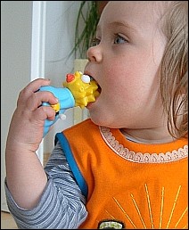 Eating this hard piece of plastic might make this kid even stupider.